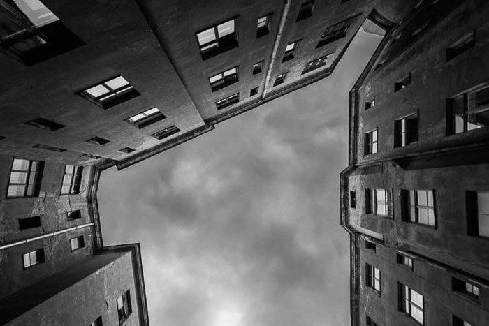  a black and white architecture photography shot of a buildings courtyard