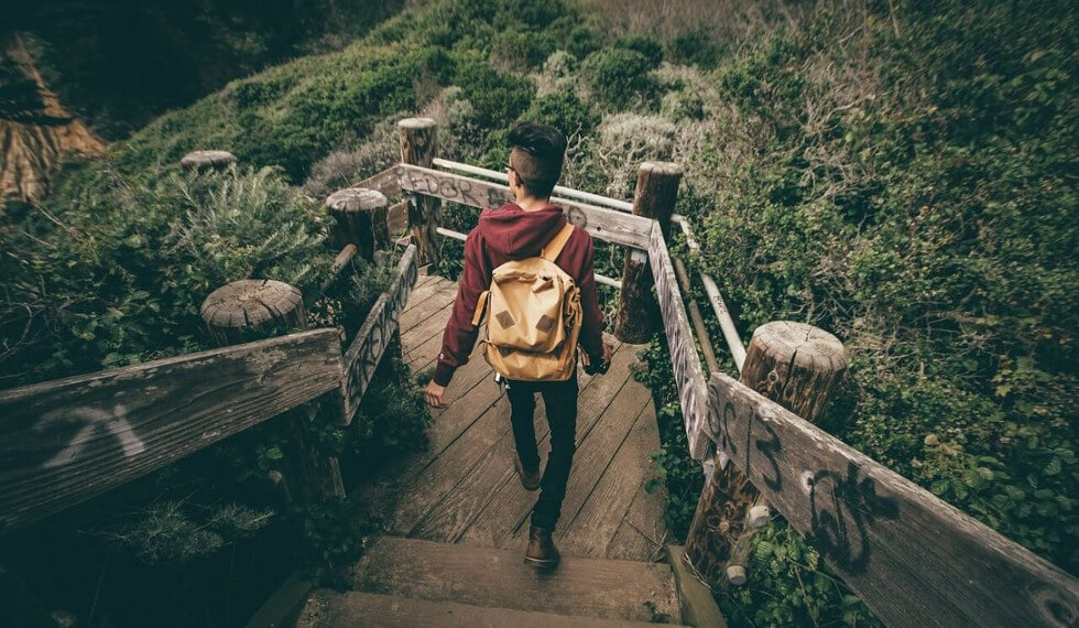 traveler going to hiking with sling backpack